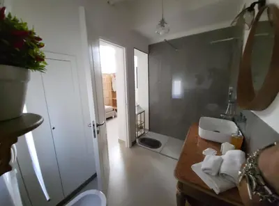a bathroom with a sink and a mirror at Malaspina Cico Suite in Palermo