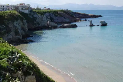a view of a beach with the ocean and buildings at Cinisi 89 B&B in Cinisi
