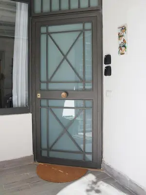 a glass door with a metal frame on a house at Il corvo e la volpe in Palermo