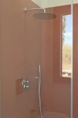 a shower in a bathroom with a window at Villa Beba in Cefalù