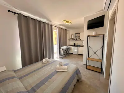 a bedroom with a bed with towels on it at Summer Vibes in Castellammare del Golfo