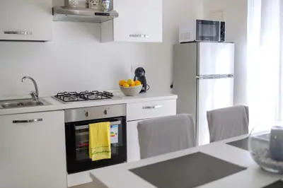 a kitchen with an oven with a bowl of fruit at La Casa al mercato - SELF CHECK-IN in Palermo