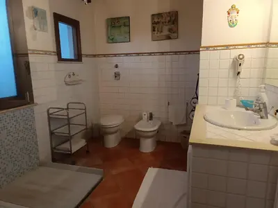 a bathroom with a toilet and a sink at Punto de Vista B&B Makari in San Vito lo Capo
