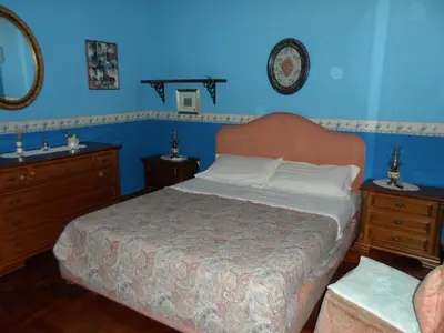a bedroom with a bed and two dressers and a mirror at Alle Terrazze del Borgo Vecchio in Palermo