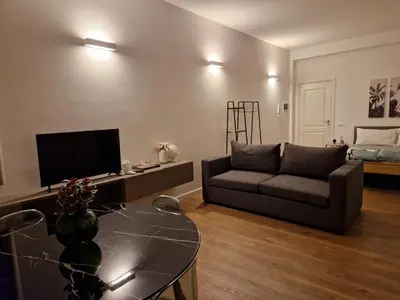 a living room with a couch and a table at SPRING APARTMENTS in Palermo