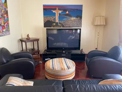 a living room with a couch and a tv at Casa Michela in Palermo