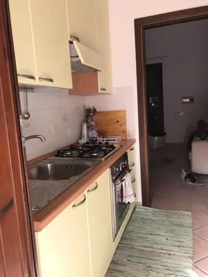 a kitchen with a sink and a stove top oven at Casa al mare a Campofelice di Roccella - Cefalù in Lascari