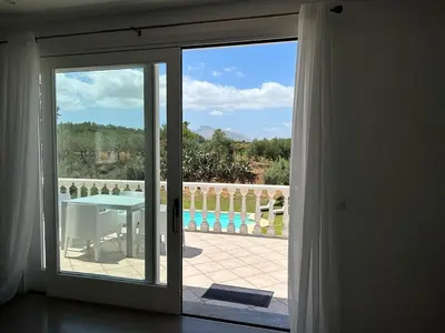 a sliding glass door with a view of a patio at Villa Rachele con piscina in Balestrate