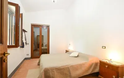 a bedroom with a bed and a door to a bathroom at Casa San Giovanni in Giuliana