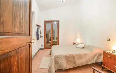 a small bedroom with a bed and a dresser at Casa San Giovanni in Giuliana
