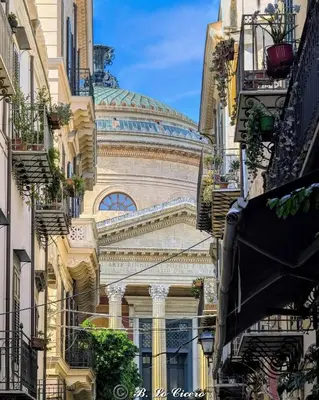 a building with a dome in the middle of a city at Casa di Leda 2 in Santa Flavia