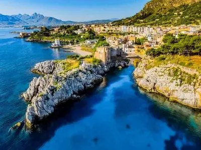 an aerial view of a town on the water at Casa di Leda 2 in Santa Flavia