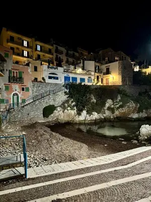 a group of buildings and a river at night at Casa di Leda 2 in Santa Flavia