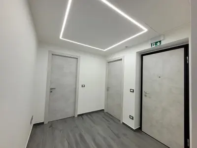 an empty hallway with two doors and a ceiling at SP Rooms in Isola delle Femmine