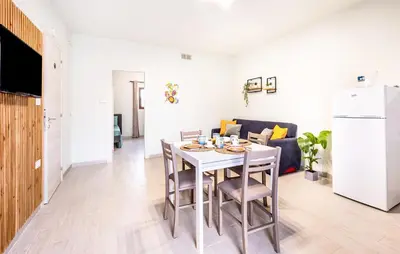 a kitchen and living room with a table and chairs at Lovely Apartment In Trappeto With Wifi in Trappeto