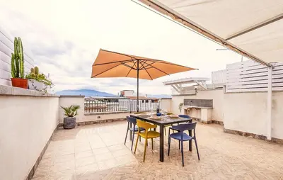 a patio with a table and chairs and an umbrella at Lovely Apartment In Trappeto With Wifi in Trappeto