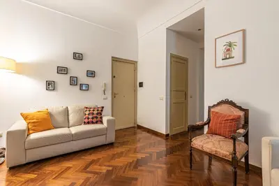 a living room with a couch and a chair at Casa Marettu in Palermo
