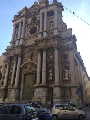 a large building with cars parked in front of it at Casa degli Allori in Palermo