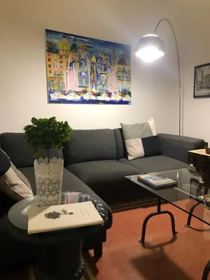 a living room with a couch and a table at Casa degli Allori in Palermo
