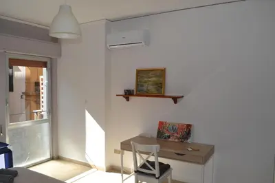 a room with a wooden desk and a chair at 4 Country Side - City Center in Palermo