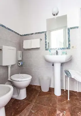 a bathroom with a toilet and a sink at Miss Sicily B&B in Terrasini