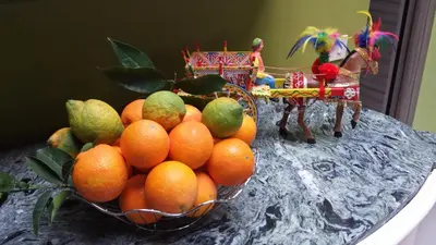 a bowl of oranges and pears on a table at Miss Sicily B&B in Terrasini