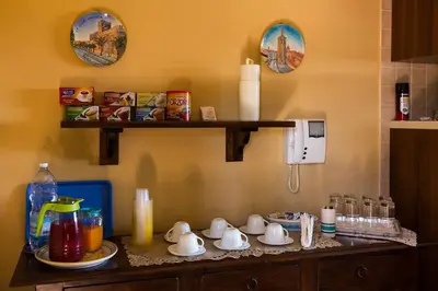 a kitchen counter with cups and teapots on it at Bed And Breakfast Marina d'Aspra in Bagheria