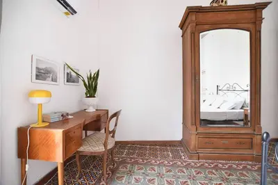 a room with a desk and a large mirror at iFlat Casa Ponticello Kemonia in Palermo