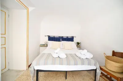 a bedroom with a bed with towels on it at iFlat Casa Ponticello Kemonia in Palermo