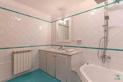a bathroom with a tub and a sink and a shower at Vero Sicily - Villa Acqua Chiara in Bagheria
