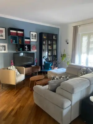 a living room with a couch and a tv at MONTE PELLEGRINO HOUSE AND TERRACE in Palermo