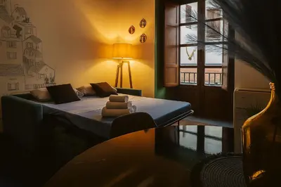a bedroom with a bed and a window at La Residenza dell' Alloro in Palermo