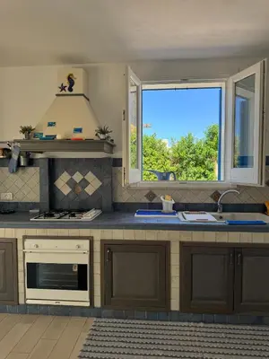 a kitchen with a sink and a window at Marilù Casa Vacanza in San Vito lo Capo