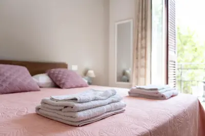 a room with two beds with towels on them at Gennaro Holidays in Corleone
