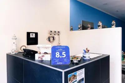 a counter with a price sign on top of it at B&B A Mare in Castellammare del Golfo