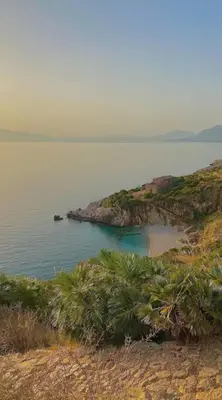 an island in the middle of a body of water at Makari Bay Home in San Vito lo Capo