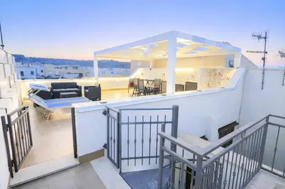 a balcony with a view of a living room at Appartamento Dolceluna in San Vito lo Capo