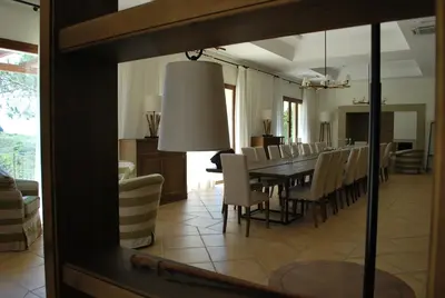 a dining room with a long table and chairs at Feudo Del Biviere in Santa Ninfa