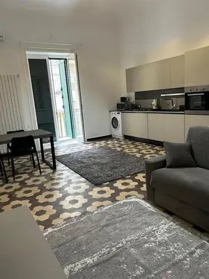 a living room with a couch and a table at MARGOT HOUSE PALERMO in Palermo