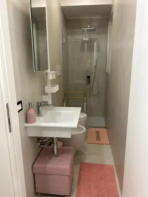 a bathroom with a sink and a toilet and a shower at MARGOT HOUSE PALERMO in Palermo