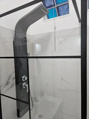 a glass table with a shower in a bathroom at Simone Cupolas View in Palermo