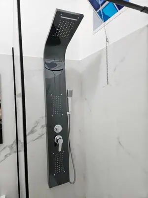 a black remote control hanging on a wall at Simone Cupolas View in Palermo