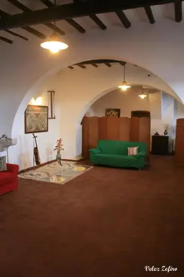 a living room with a green couch in a room at Baglio 