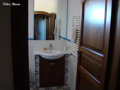 a bathroom with a sink and a mirror at Baglio 