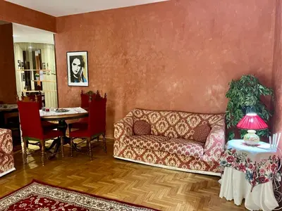 a living room with a couch and a table at Sicilian Apartment in Termini Imerese