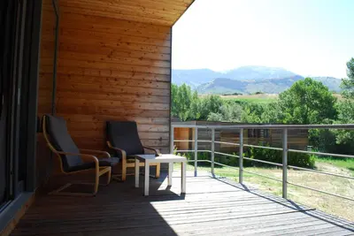 two chairs and a table on a porch with a view at Il Bevaio Di Corleone in Corleone