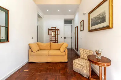 a living room with a couch and a table at Casa Goethe delle Volte by Wonderful Italy in Palermo