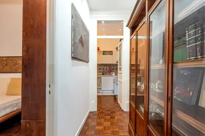 a hallway with a room with a bed and a kitchen at Casa Goethe delle Volte by Wonderful Italy in Palermo