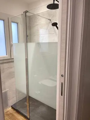 a bathroom with a toilet and a sink and a window at SAMMARTINO LUXURY APARTMENT in Palermo