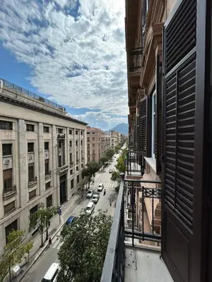 a logo for a market agreement with a building and plants at Marlè apartment in Palermo